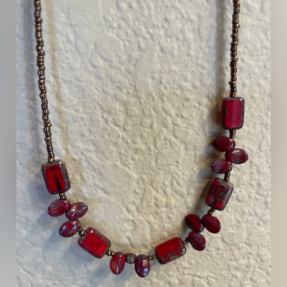 ⭐️ Bronze beaded chain with deep red and blueish - green beads